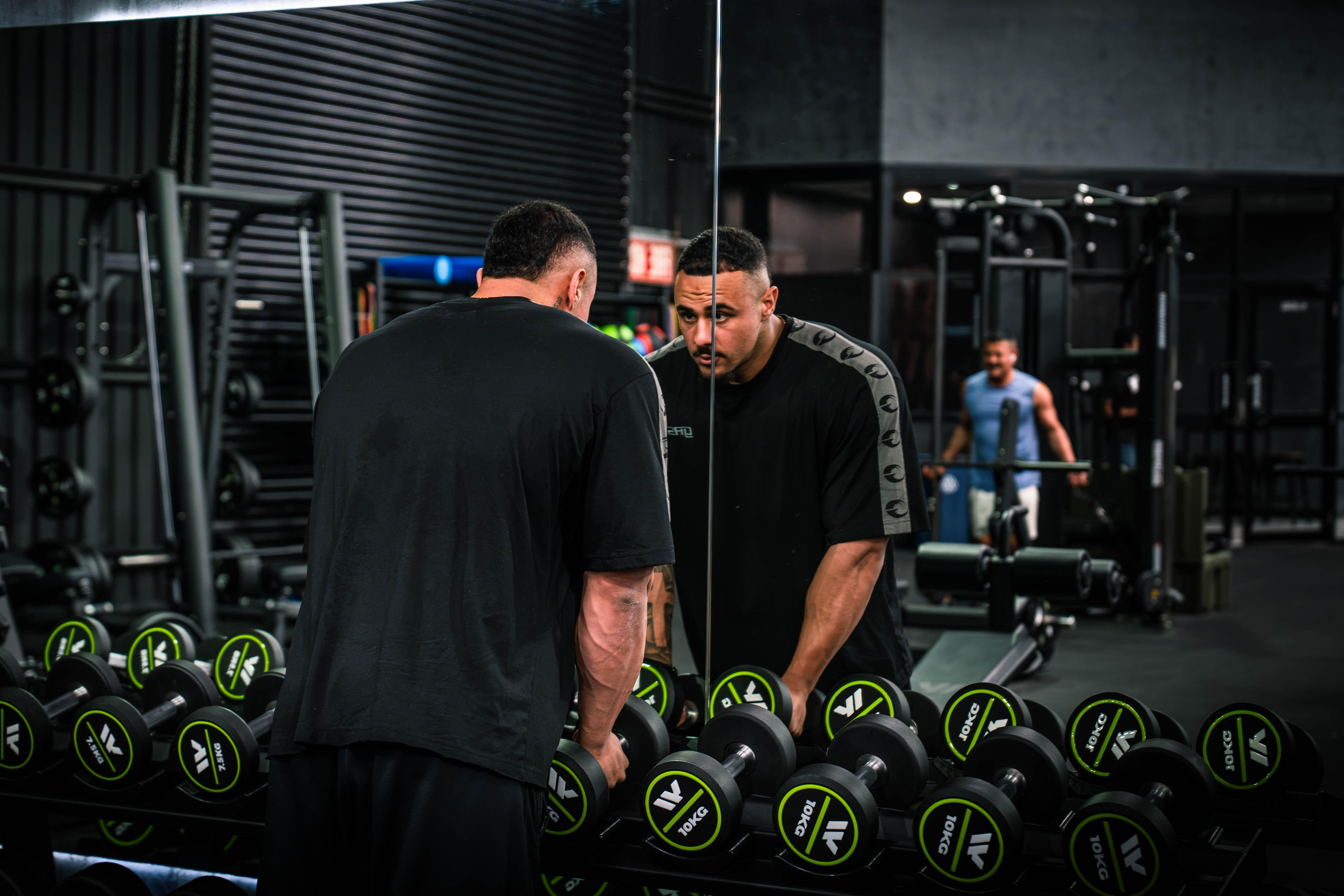 Angelo Yazbek focused in a gym mirror