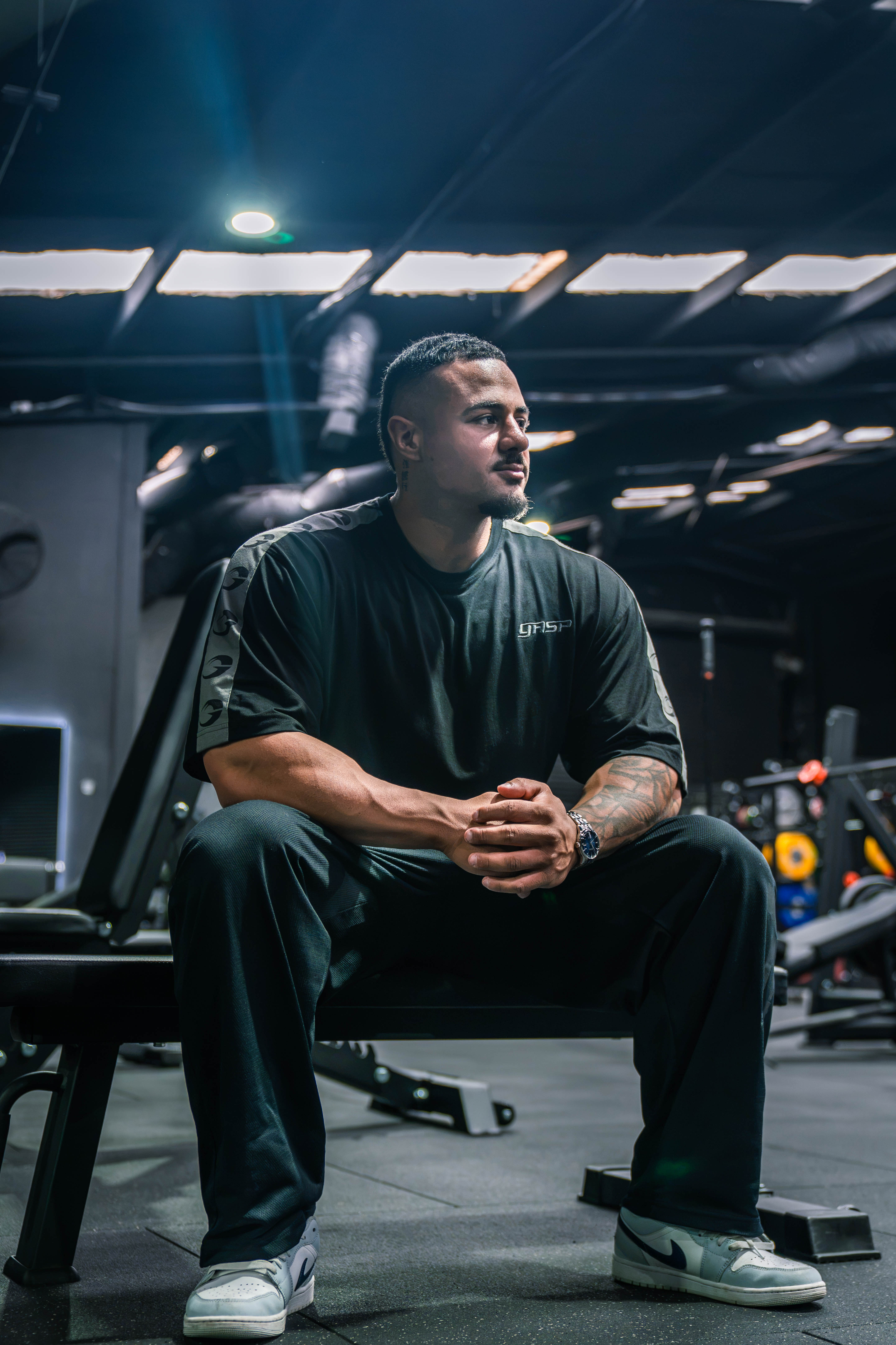 Angelo Yazbek seated in the gym